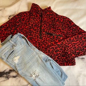 Red cheetah quarter zip fleece jacket.